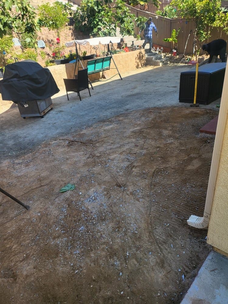 Bare dirt San Diego backyard before paver patio installation